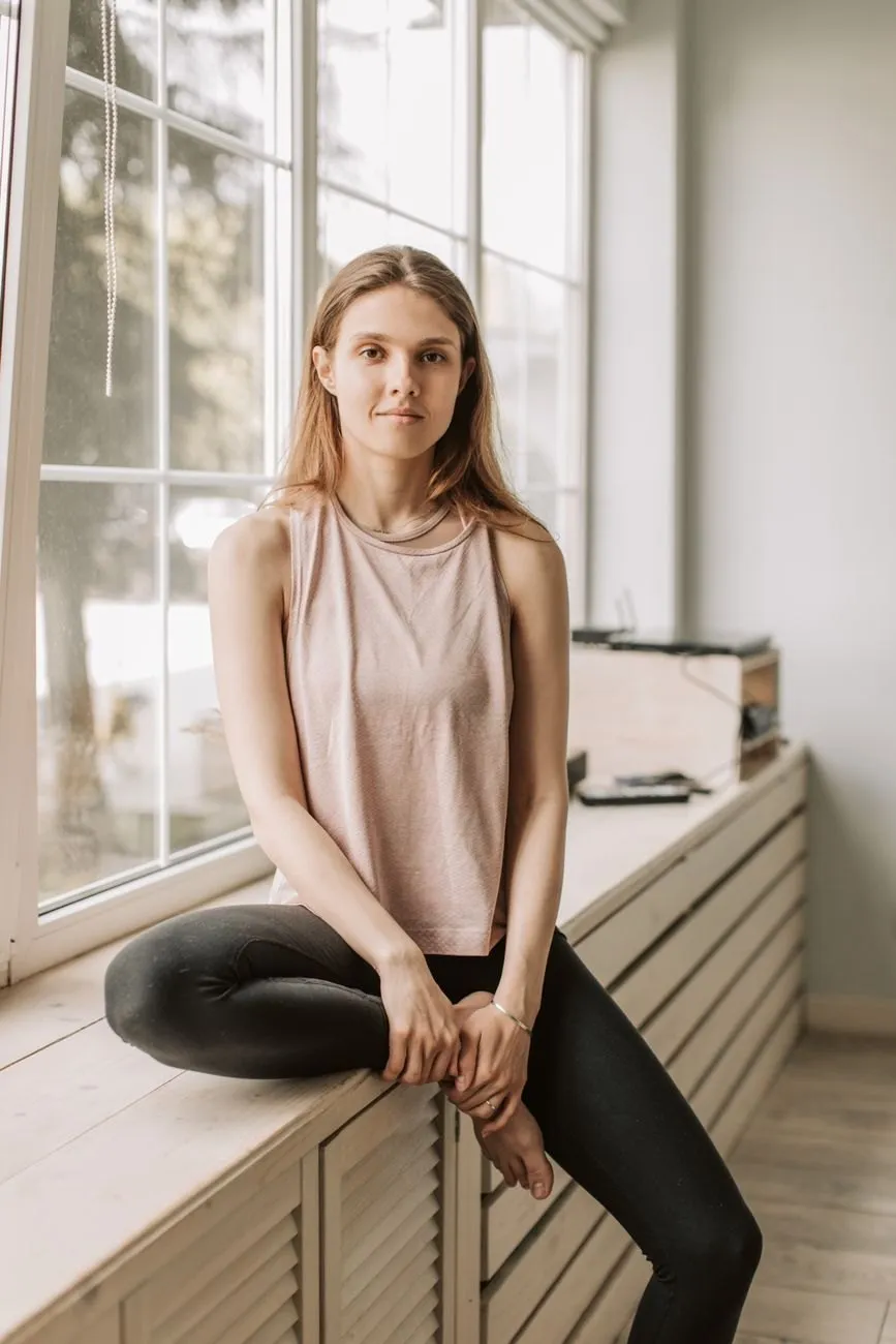 A serene portrait in soft natural light and warm neutral tones