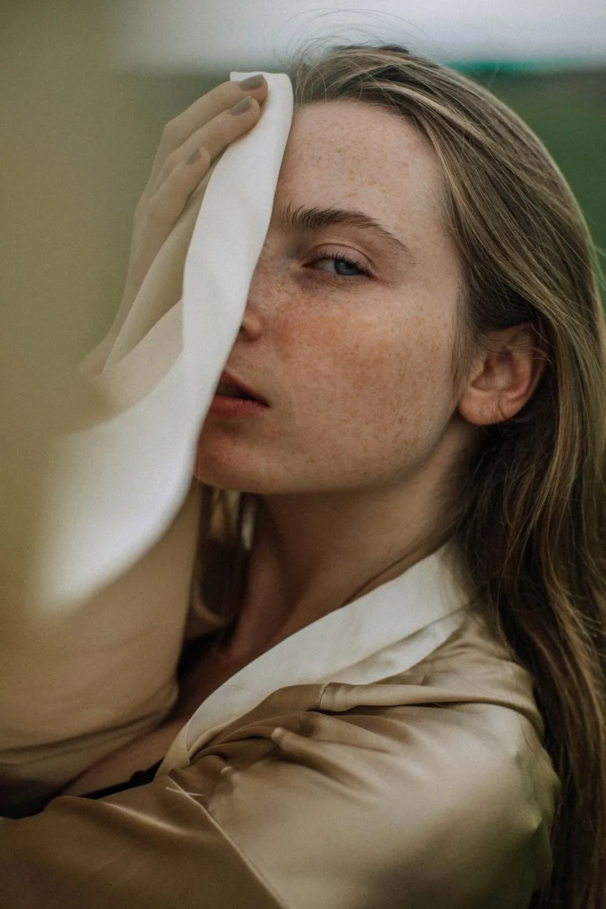 Editorial portrait of natural, glowing skin in warm light